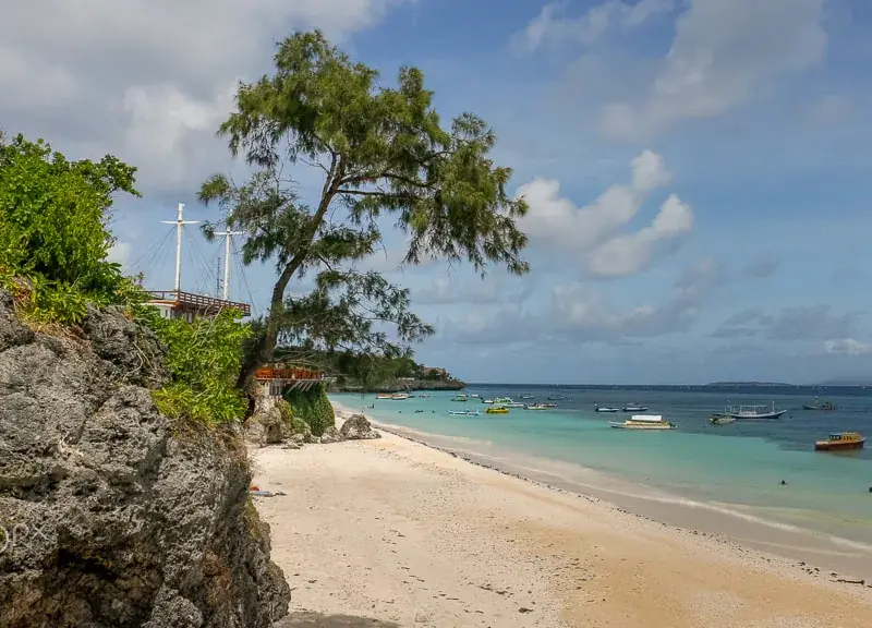 The white-sand shore at Tanjung Bira, South Sulawesi, where phinisi hulls are built in the open air
